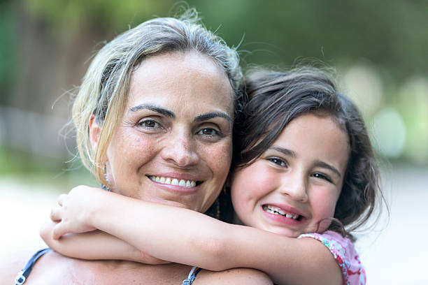 istock woman posing with her daughter 486140784