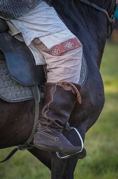 istock Horse rider leg boot saddle leather details closeup 486141176