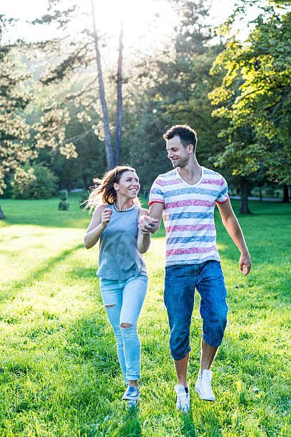 istock Young couple enjoys the outdoors in the park 486143580