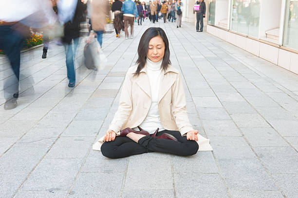 istock Woman Relaxing in a Crowded Street 486144524