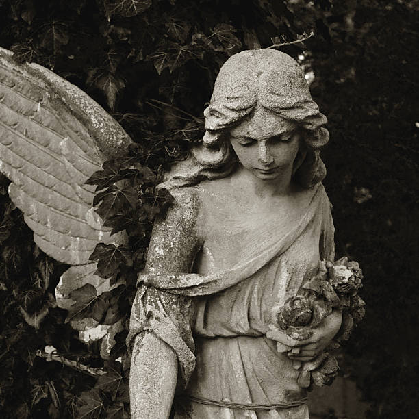 istock Vintage image of a sad angel on a cemetery 486145318