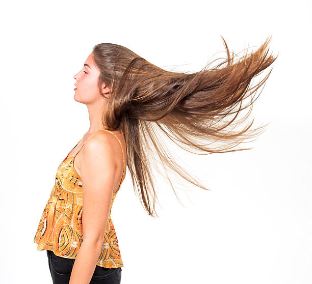 istock attractive young woman lets her hair fly 486148560