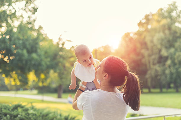 istock mother with baby in the park 486155930