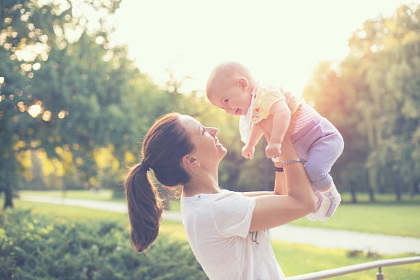 istock mother with baby in the park 486155948