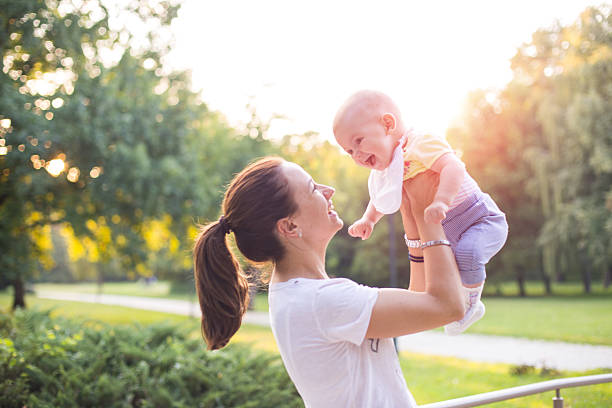 istock mother with baby in the park 486155950