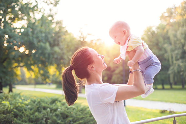 istock mother with baby in the park 486155952