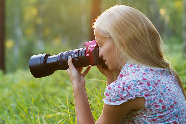 istock Young woman photographer in a forest 486159096