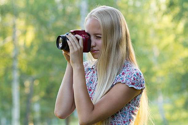 istock Young woman photographer in a forest 486162066