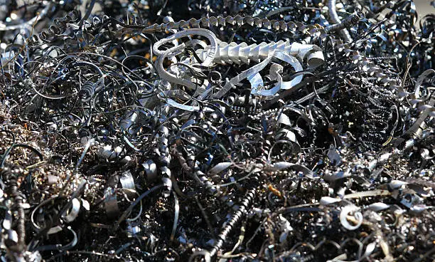 mountain of chips and curls of ferrous metal into landfill for recycling 3