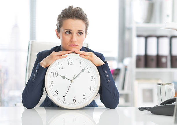 istock frustrated business woman with clock 486165955