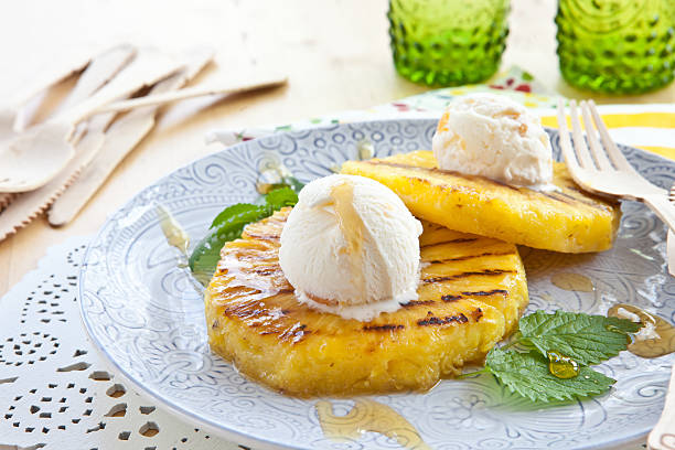 Grilled pineapple with ice cream stock photo