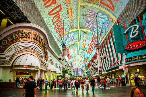 Las vegas, USA - June 16, 2012: people visit Fremont Street in Las Vegas, Nevada . The street is the second most famous street in the Las Vegas. Fremont Street dates back to 1905, when Las Vegas was founded.