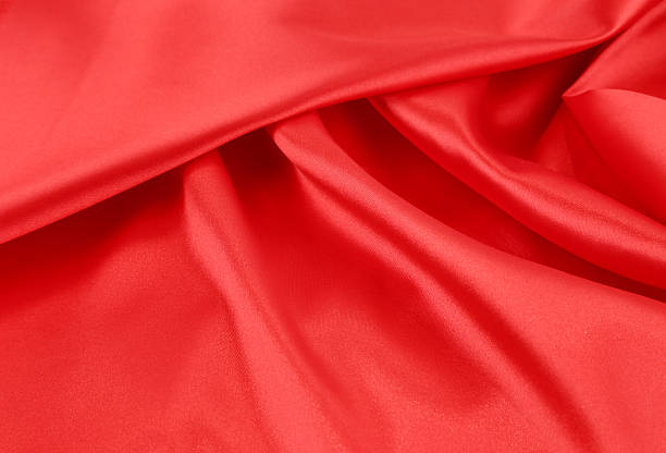 istock Close up of red silk fabric background. 486168045