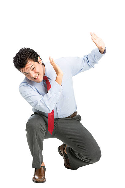 istock Intimidated Latino Office Worker Protecting Abuse 486168368
