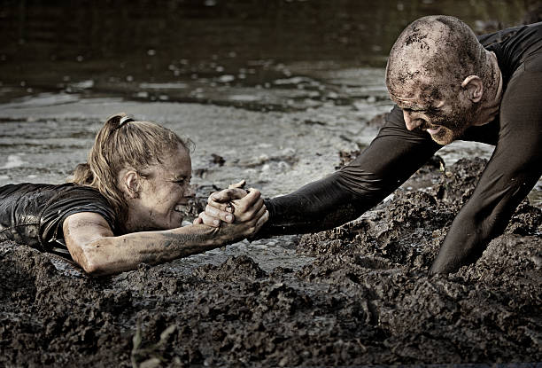 istock man pulling out of water laughing woman 486168674