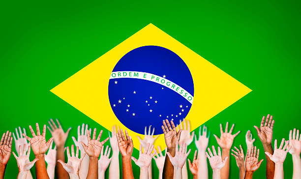 istock Multi-Ethnic Hands With Flag Of Brazil For The Background 486169321