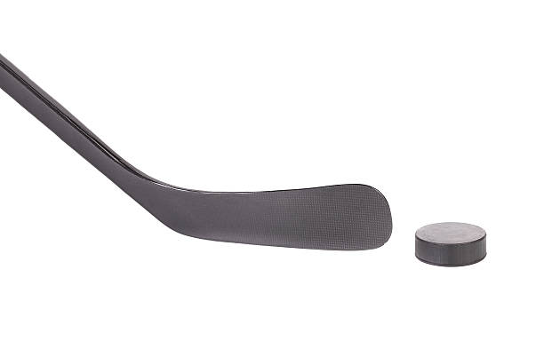 istock Black ice hockey stick and puck. 486169839