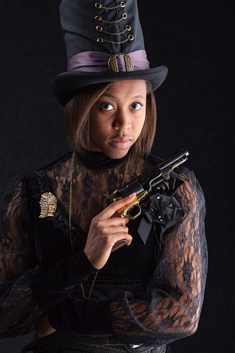 Cute black girl wearing Victorian Steampunk clothes.