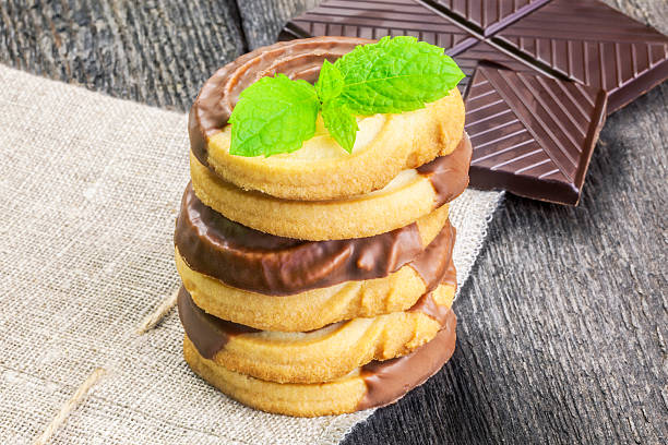 istock Cookies with chocolate and mint leaves table 486175502