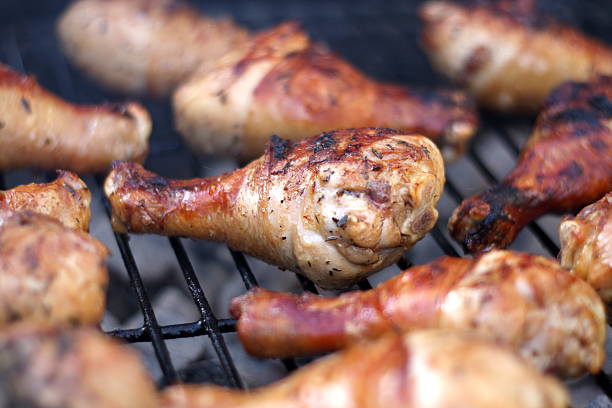 istock Closeup of Chicken Legs on the Barbeque 486176258