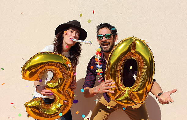 istock Cheerful couple celebrates a thirty years birthday 486176384