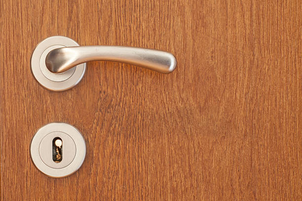 istock Modern style handle on natural wooden door 486180904