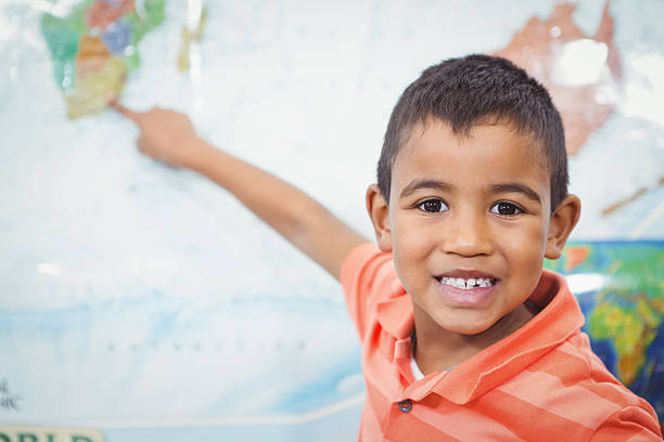 istock Student pointing to a map of the world 486181182