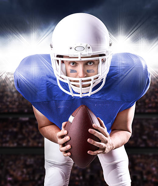 istock Football Player on blue uniform isolated in the stadium 486181318