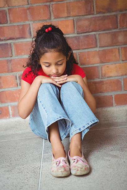 istock Upset lonely girl sitting by herself 486184602