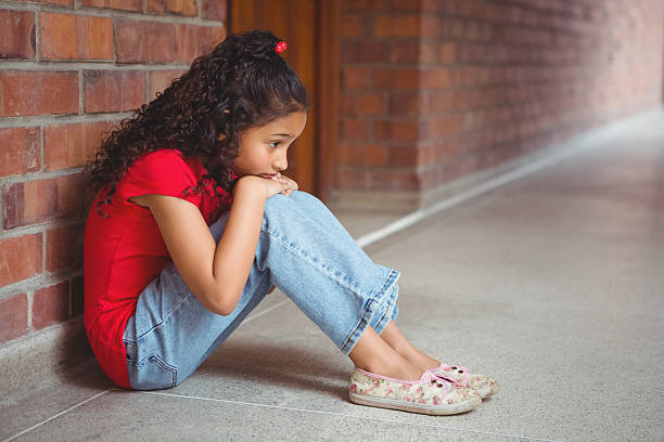istock Upset lonely girl sitting by herself 486184610