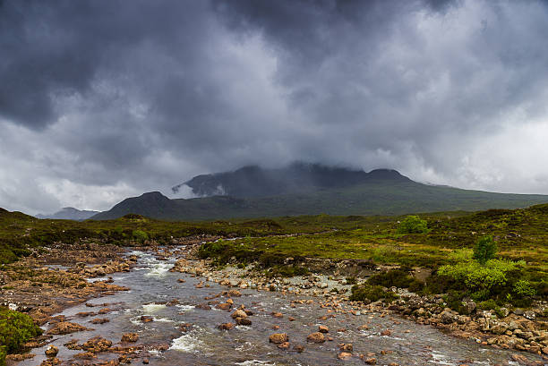 istock River in the fields, Skye island, Scotland 486187846