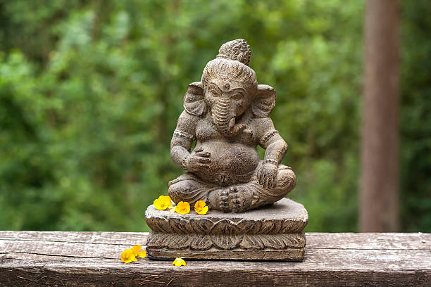 istock Ganesha with yellow flowers 486190736