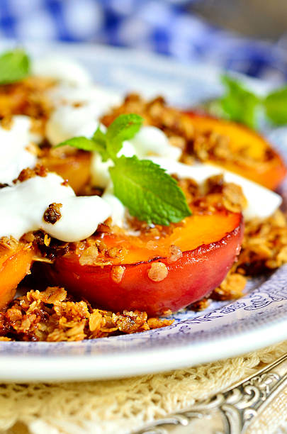 istock Grilled peachs with granola and whipped cream. 486190768