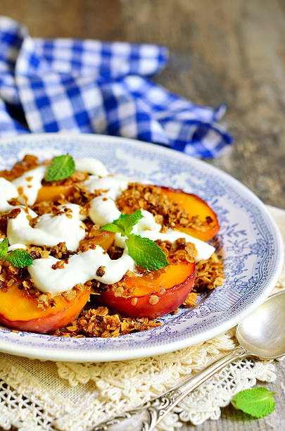 istock Grilled peachs with granola and whipped cream. 486190772