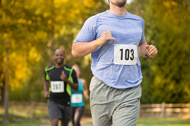 istock Young adult running in a race 486196210