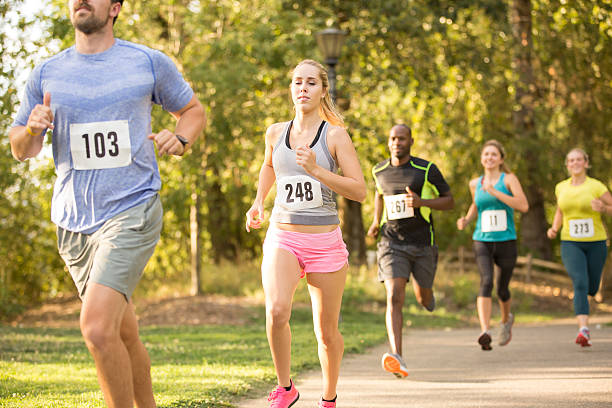 istock Group of young adults running in a race 486196252