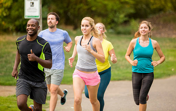 istock Group of young adults running in a race 486196294