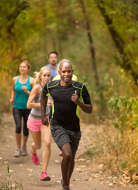 istock Group of young adults running in a race 486196300