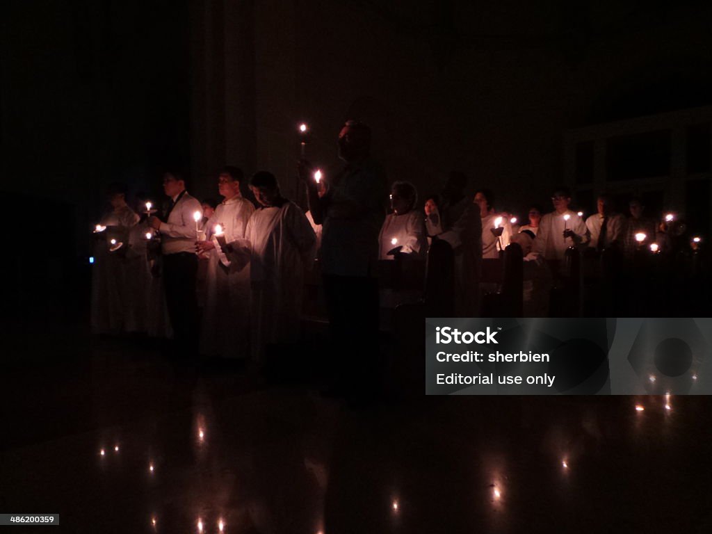 Easter Vigil mass at Manila Cathedral Intramuros, Philippines - April 19, 2014: Easter Vigil mass celebrated at Manila Cathedral on the evening of Black Saturday where attendees lit candles on the opening prayers marks the start of Easter in the Catholic world, Candle Stock Photo