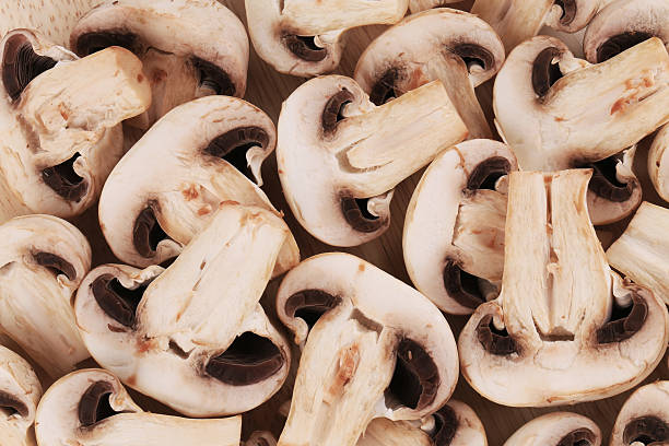 istock Bunch of white mushrooms close up. 486200475