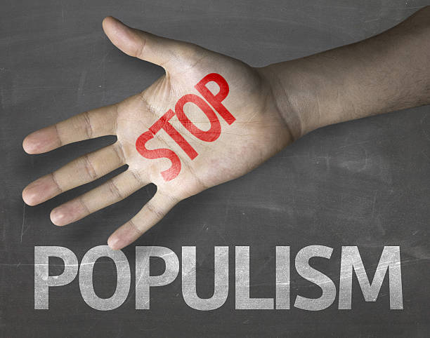 Educational and Creative composition with the message Stop Populism Educational and Creative composition with the message Stop Populism on the blackboard global populism stock pictures, royalty-free photos & images