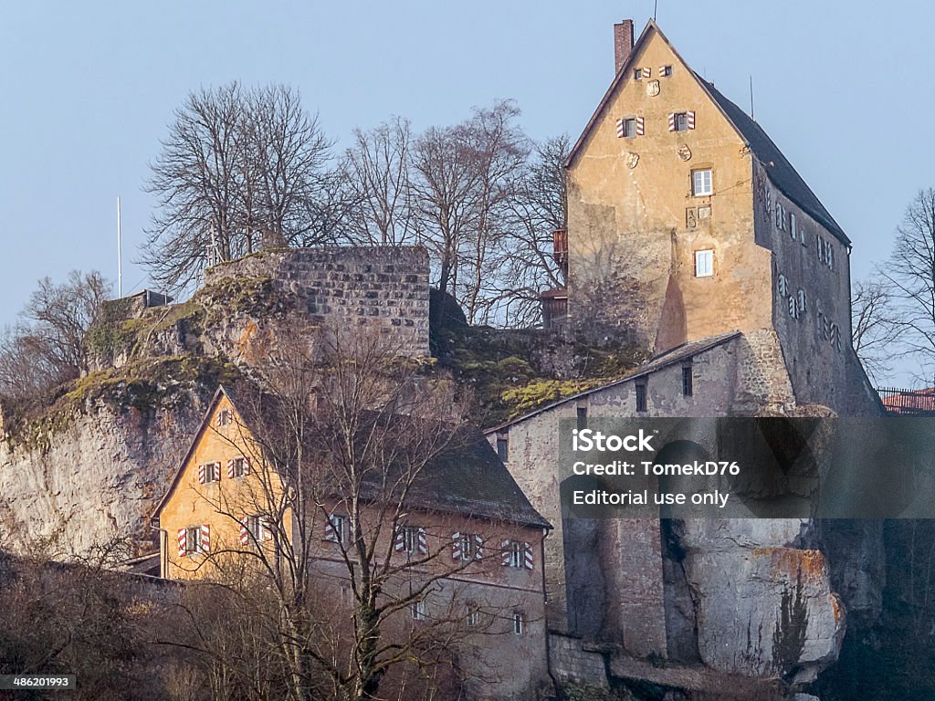 Pottenstein Pottenstein, Germany - March 7, 2014: Pottenstein castle is one of the oldest castles in Franconian Switzerland and home to a castle museum. It rises on a rock overlooking the homonymous city Pottenstein in the Upper Franconian district of Bayreuth in Bavaria. Architecture Stock Photo