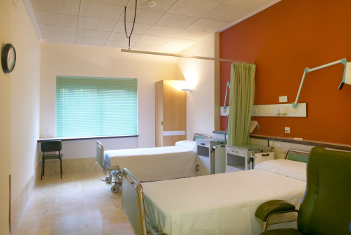 Hospital room with beds and furniture. Horizontal