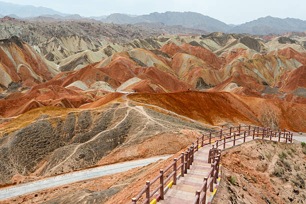 Colorful mountain in Danxia landform in Zhangye, Gansu of China The Danxia landform (Chinese: 丹霞地貌; pinyin: dānxiá dìmào) refers to various landscapes found in southeast and southwest China that "consist of a red bed characterized by steep cliffs". It is a unique type of petrographic geomorphology found in China. Danxia landform is formed from red-coloured sandstones and conglomerates of largely Cretaceous age. The landforms look very much like karst topography that forms in areas underlain by limestones, but since the rocks that form danxia are sandstones and conglomerates, they have been called "pseudo-karst" landforms. danxia landform stock pictures, royalty-free photos & images