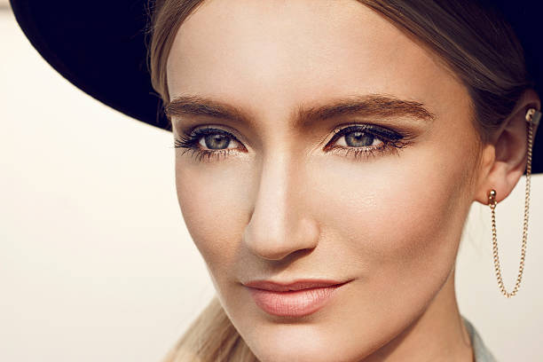 istock Beautiful young woman with black hat 486205858