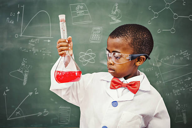 Composite image of math and science doodles Math and science doodles against focus pupil holding at red liquid  biochemist photos stock pictures, royalty-free photos & images