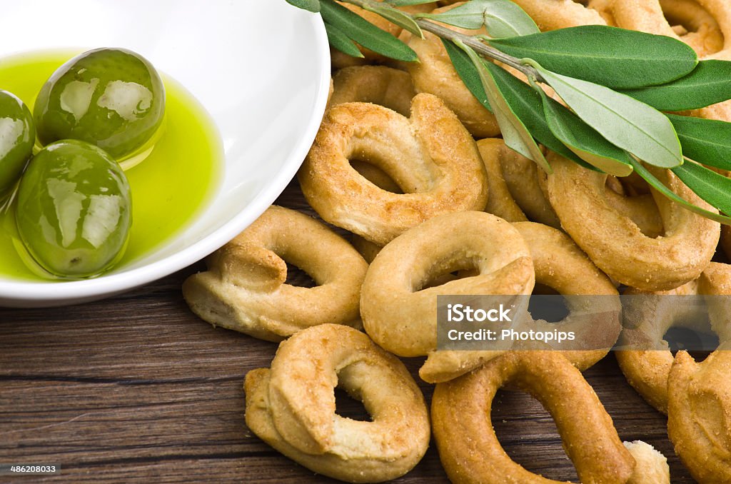 Taralli biscuit Taralli biscuit with ingredients on the wood table Taralli Stock Photo