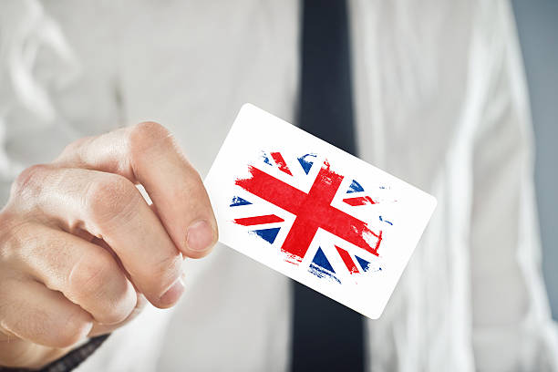 istock British Businessman holding business card with Great Britain Fla 486236103