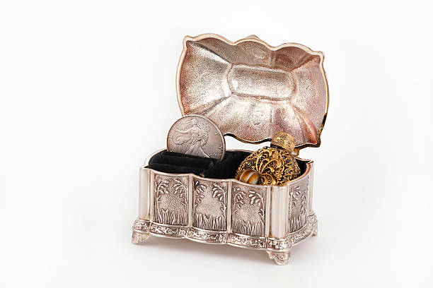 istock Bottle of perfume in the casket 486236605