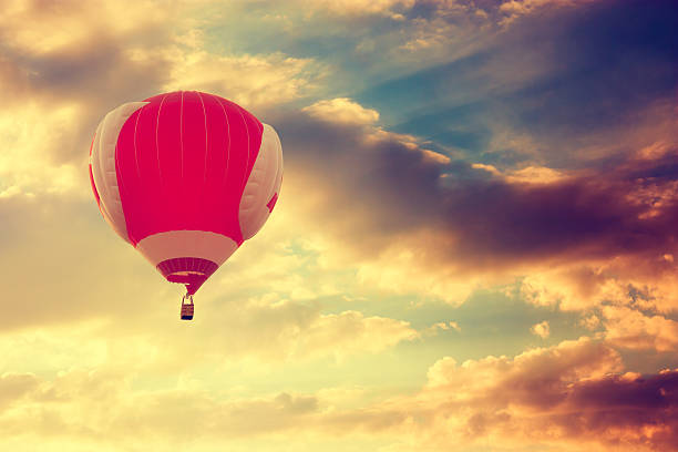 istock Hot Air Balloon Flying over Dramatic Sunset Sky 486237657